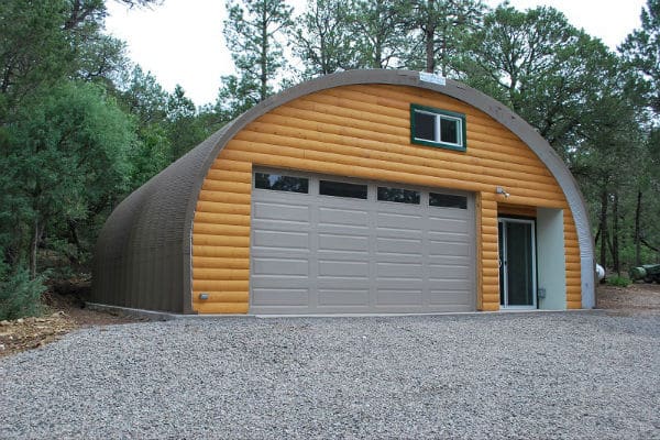 steel garage with cabin logs for siding