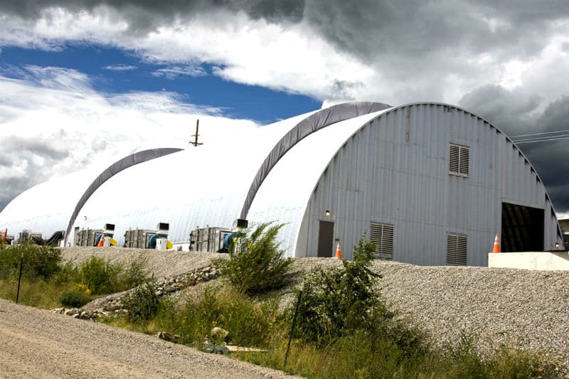 exterior of large multiple steel arch Q model buildings used at the Los Alamos National Lab