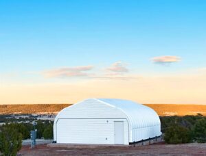 steel quonset hut observatory with white endwall