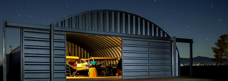 metal quonset hut hangar with steel front and sliding hangar doors 