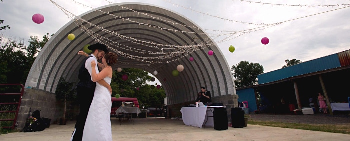 wedding reception under steel Quonset Hut