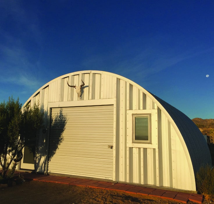 Quonset Hut steel building with steel endwall and moon in background