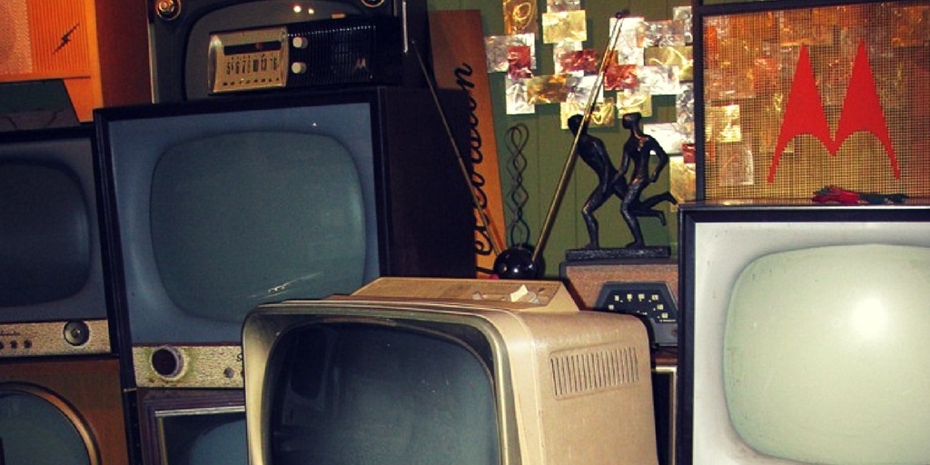 old tvs from interior of steel building