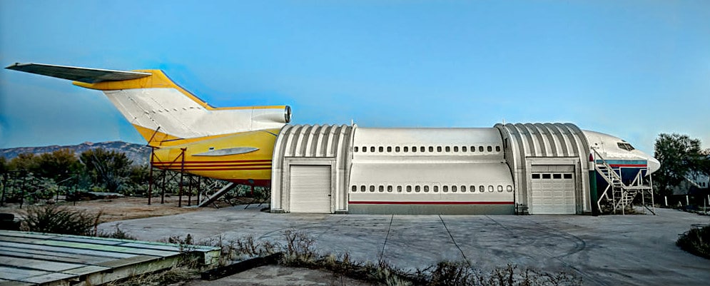 large airplane structure with steel quonset hut arches