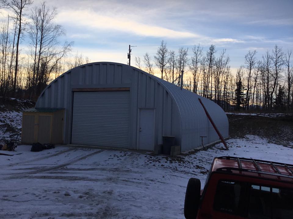 steel garage snow covered ground white garage door