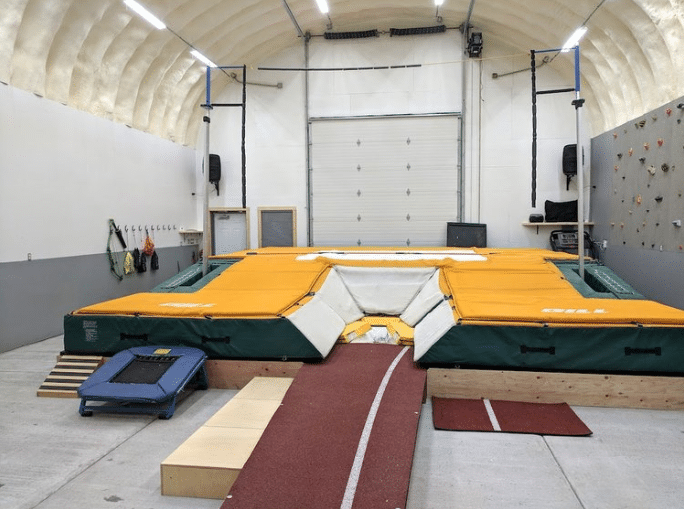 quonset hut pole vaulting facility with landing pad