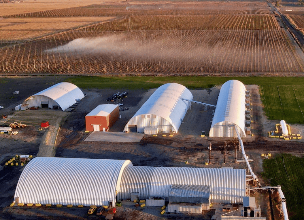 Aerial view of farm with multiple Quonsets 