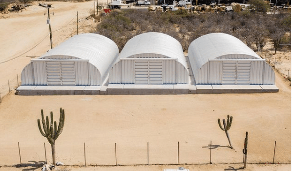 3 S model Quonset huts on concrete foundation with steel endwalls and hangar style doors