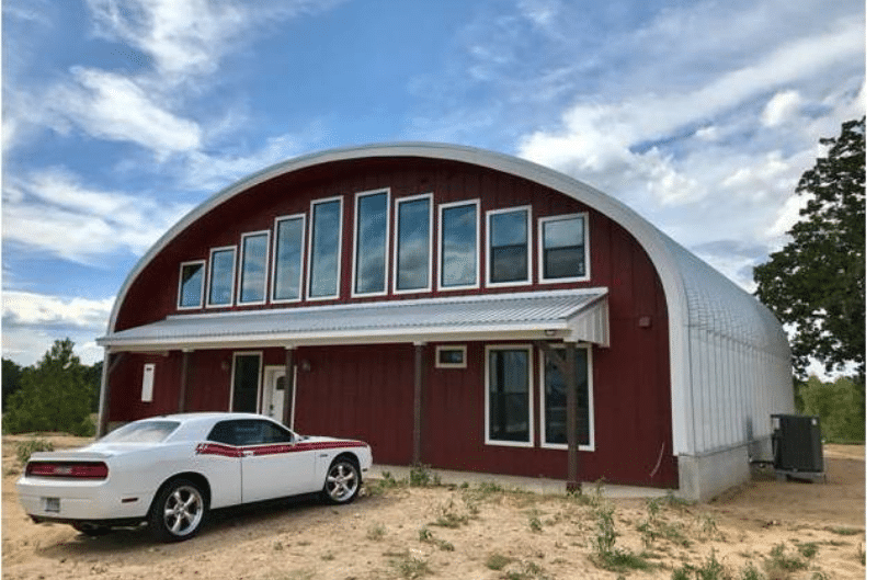s model quonset building with red front wall, windows, overhead porch