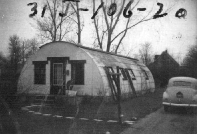 black and white photo of quonset hut