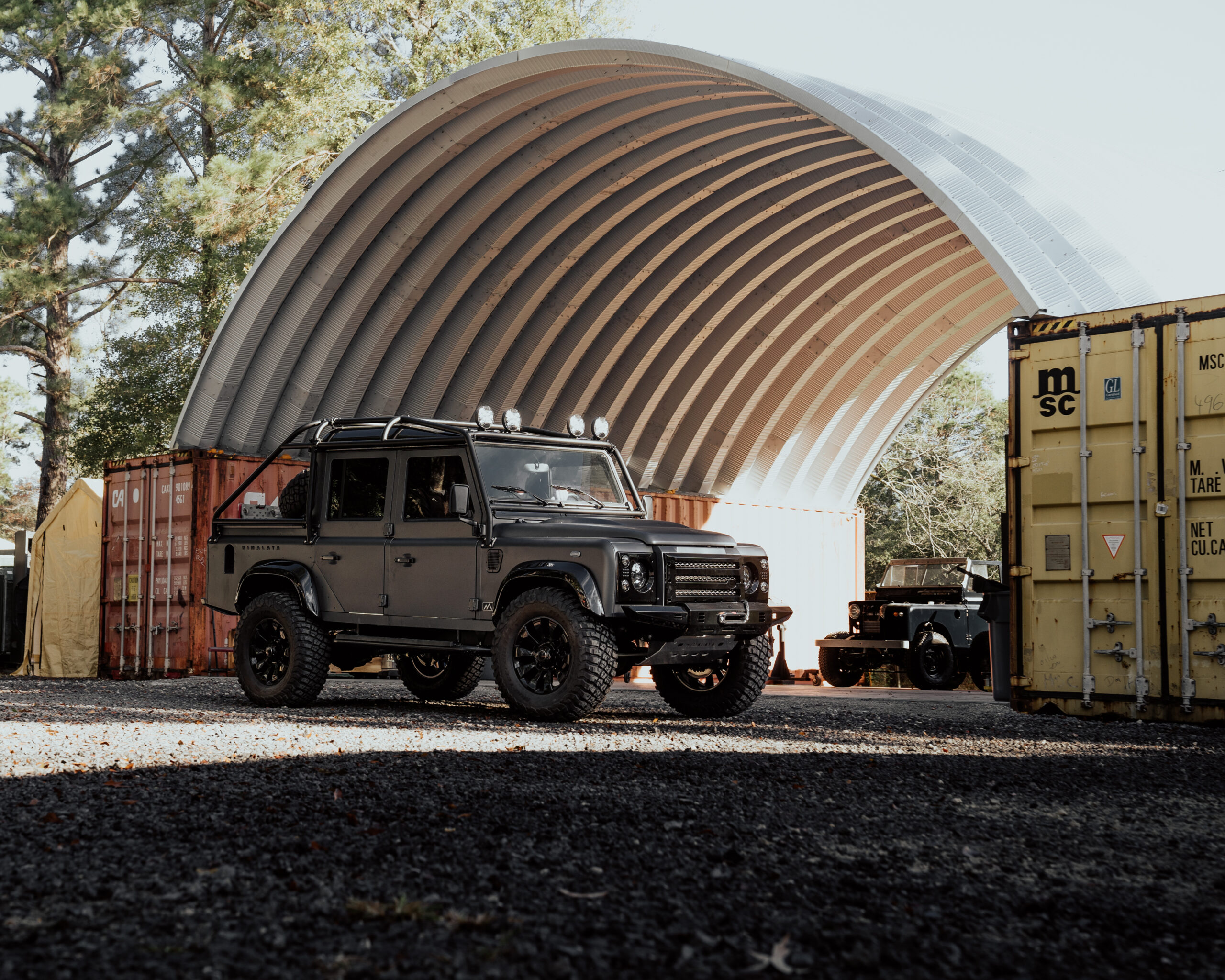 jeep in front of steel container cover