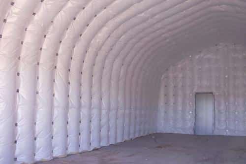 Interior of insulated quonset hut with man door