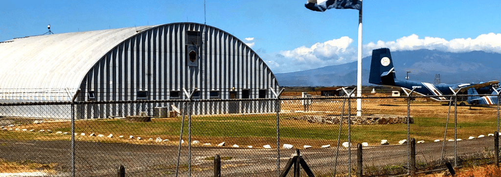 s-model airplane hangar with plane outside in costa rica