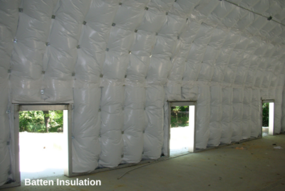 Inside of batten insulated Quonset hut with three side openings