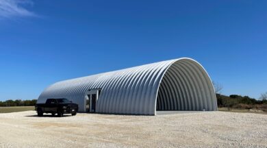 q model steel open ended storage building with gravel all around and truck parked next to it