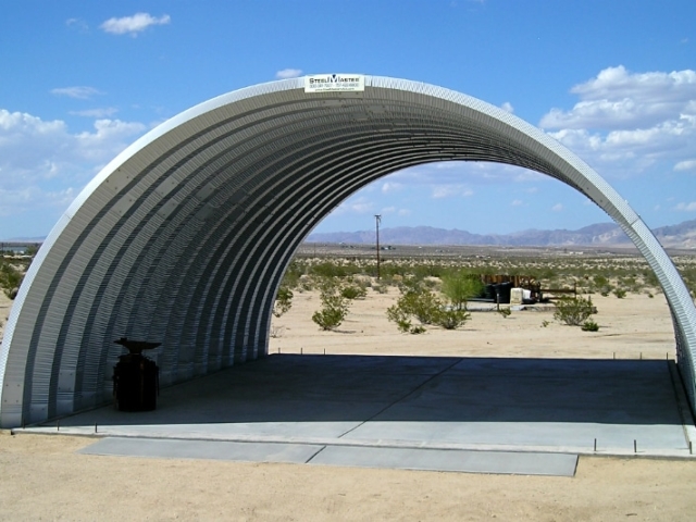 small q model steel building on concrete pad in the desert