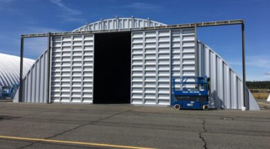 steel quonset hut hangar with sliding doors