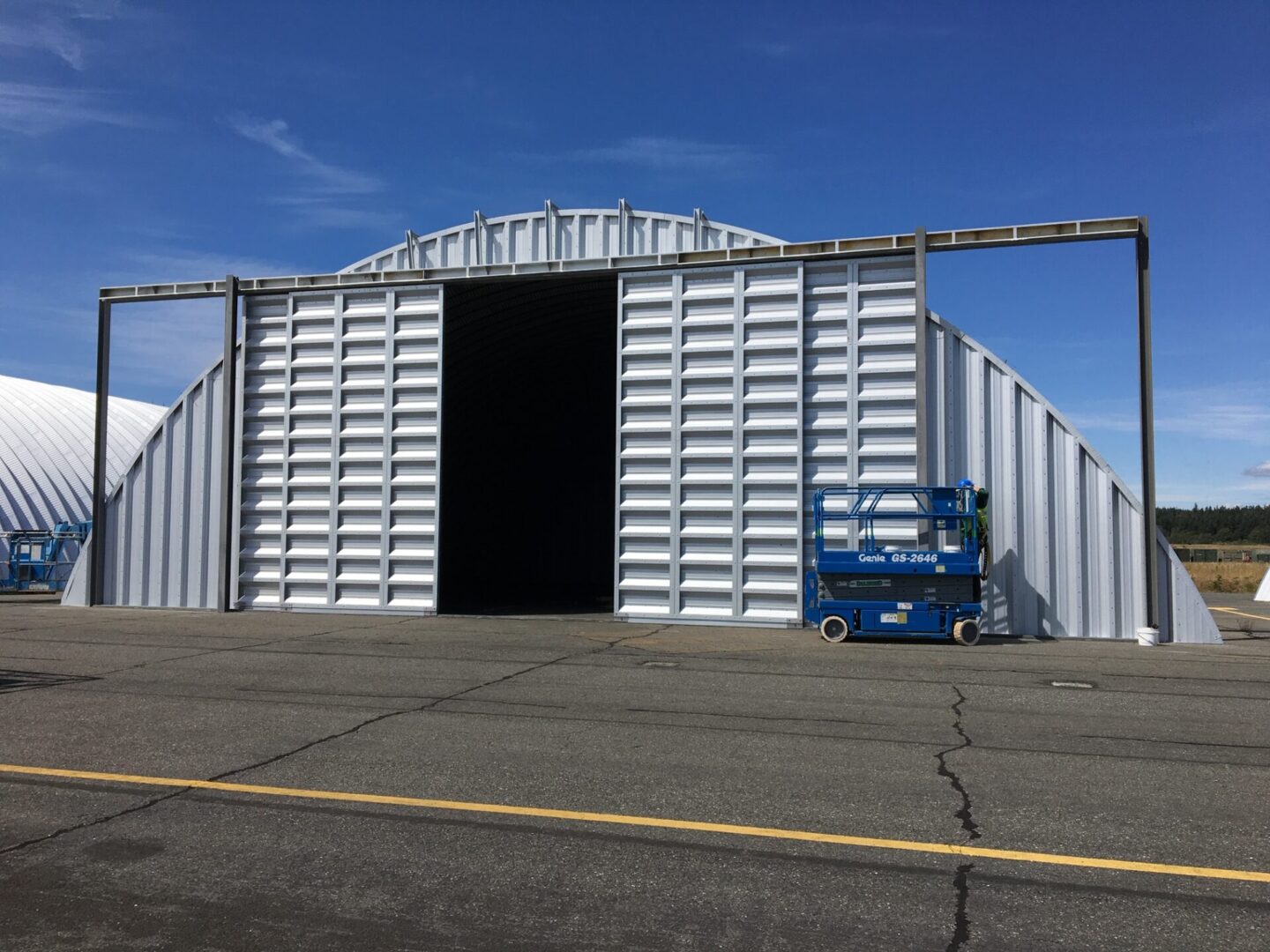 steel quonset hut hangar with sliding doors