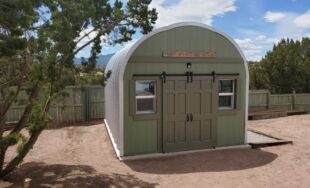 steel S model storage shed with green painted custom front endwall and green sliding doors with windows