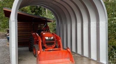 open ended s-model quonset hut with machinery inside