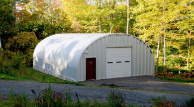 S-Model steel workshop with brown entry door and white garage door