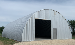 steel quonset hut q-model with front opening and side entry door