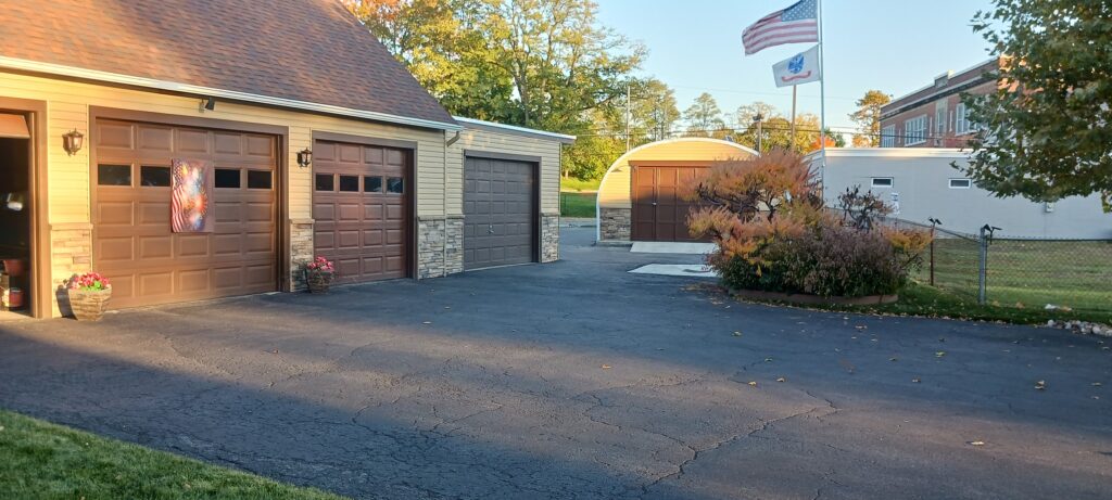 House and quonset garage with matching custom endwalls