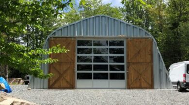 quonset hut with sliding wood doors, rolling garage door and steel endwall