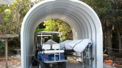 small s model steel boat storage building with boat and golf cart underneath