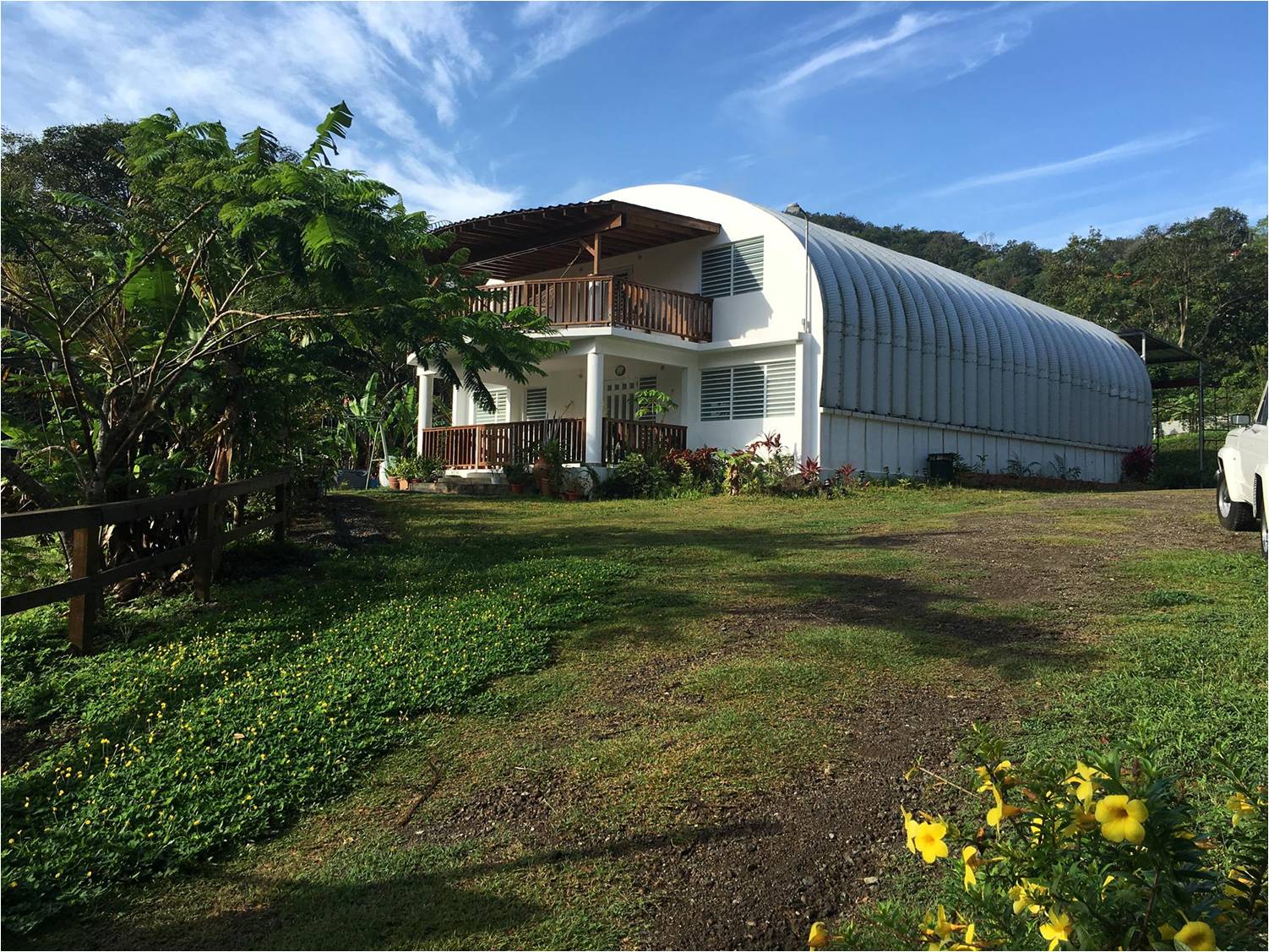 S model steel house with custom endwalls and two covered porches in the forest or Puerto Rico