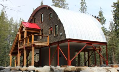 Q-Model cabin with custom stone front end wall and wooden porch