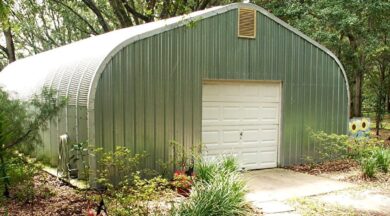 A-model Quonset hut with walkway, garden, and vent on the top of the end wall.