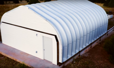 A-Model Quonset with custom white endwall and man door