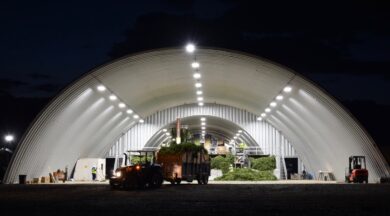 steel quonset hut processing facility with hops and other equipment