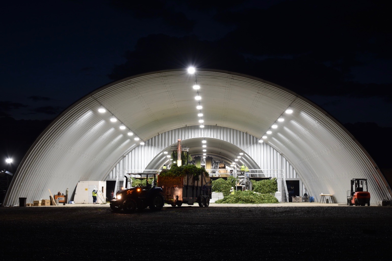 steel quonset hut processing facility with hops and other equipment
