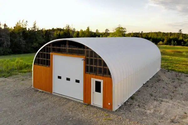 S-Model Quonset hut with custom wood and stick end wall