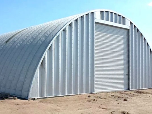 steel q model ag storage with steel endwall and white garage door
