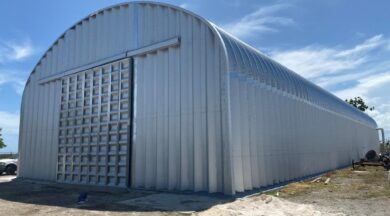 long s-model quonset hut with steel endwall and steel sliding doors