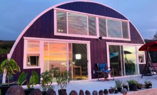 Q-model quonset home facing ocean and sunset, red endwall with windows