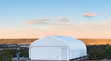 steel quonset hut observatory with white endwall